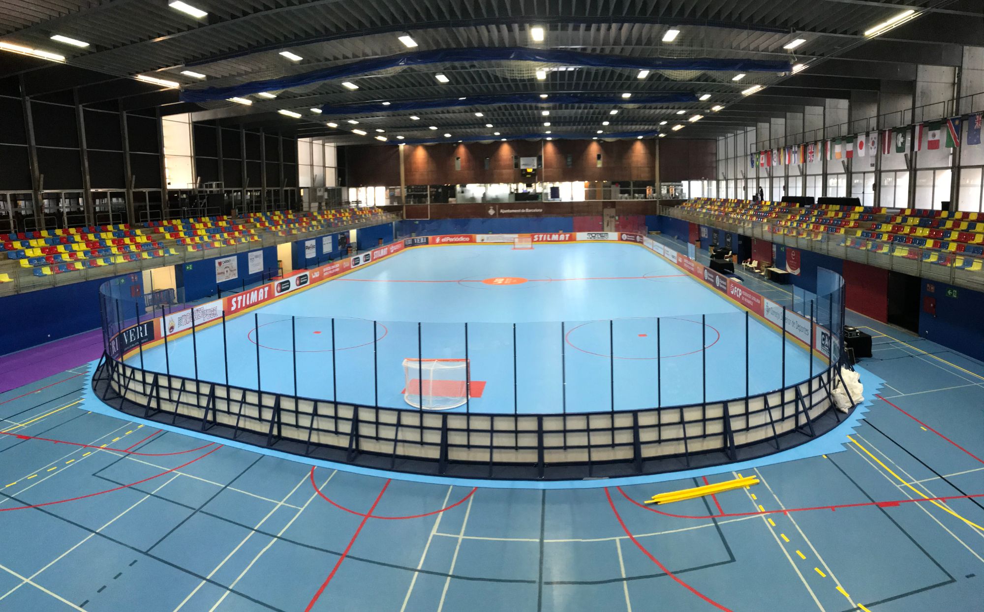 Inline hockey rink with international team flags overhead