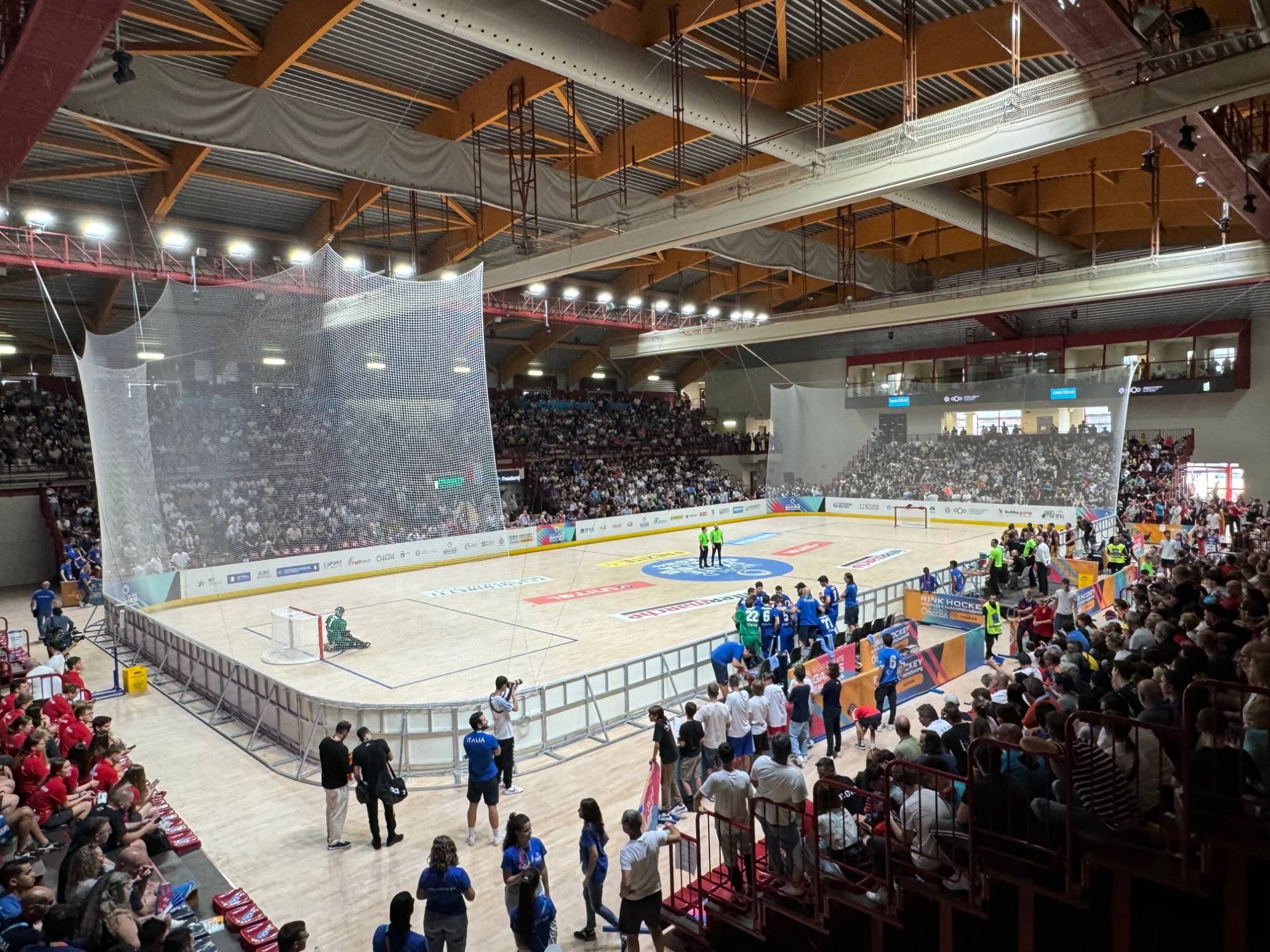 Packed rink hockey arena mid-match at the World Skate Games, built by SkateFacilities