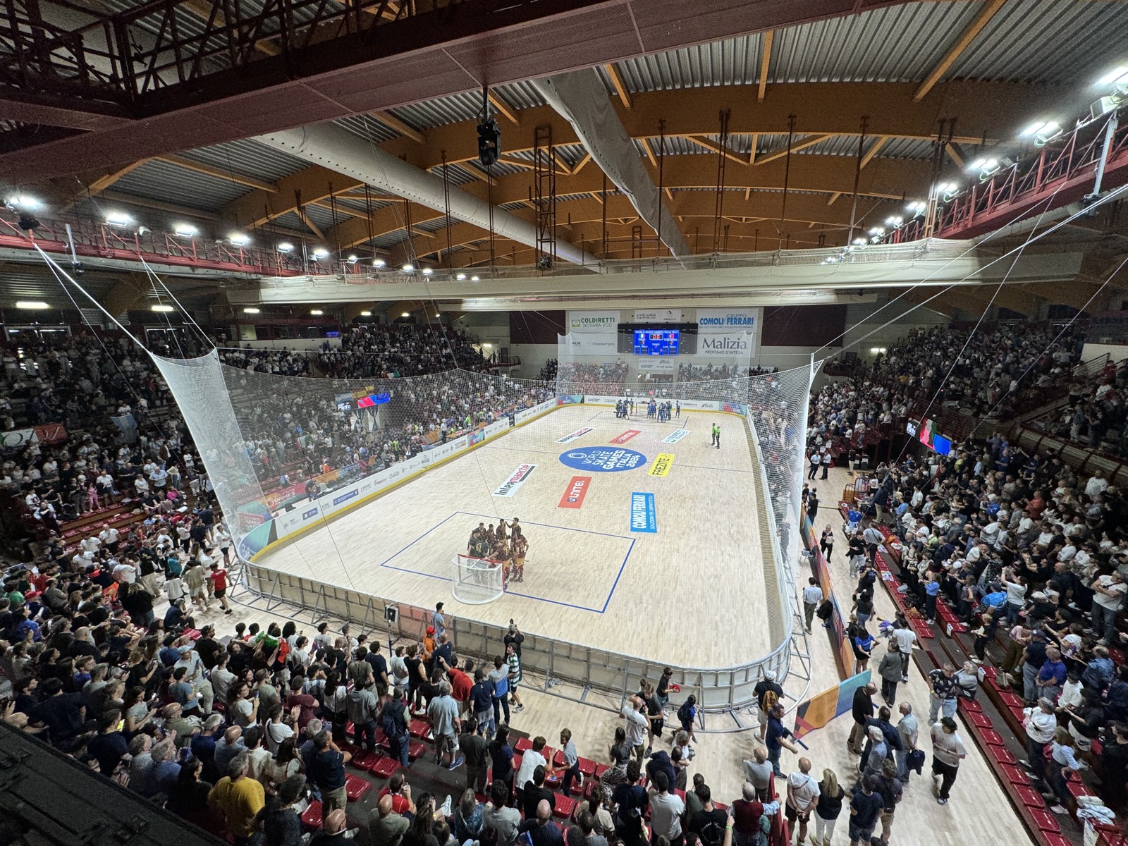 Packed rink hockey arena mid-match at the World Skate Games