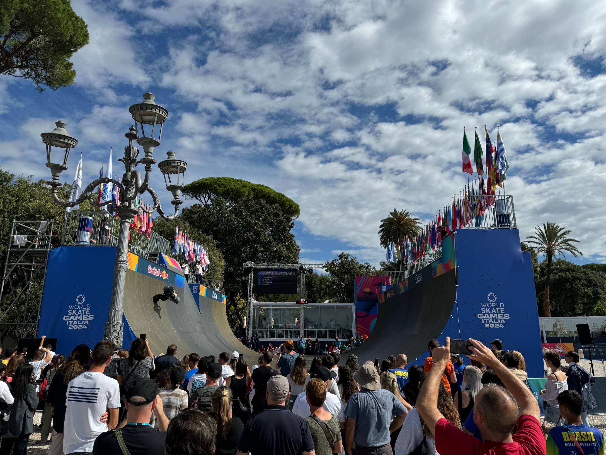 Dual vert ramps at the World Skate Games Italia 2024, skater dropping in